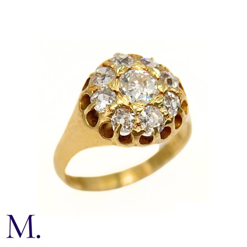 76 - A Victorian Diamond Cluster Ring. 

The antique 18ct yellow gold ring is set with nine old cut diamo... 