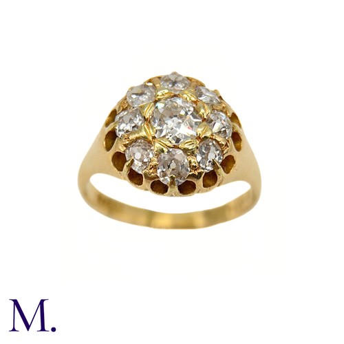 76 - A Victorian Diamond Cluster Ring. 

The antique 18ct yellow gold ring is set with nine old cut diamo... 