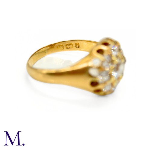 76 - A Victorian Diamond Cluster Ring. 

The antique 18ct yellow gold ring is set with nine old cut diamo... 