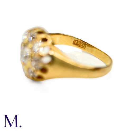 76 - A Victorian Diamond Cluster Ring. 

The antique 18ct yellow gold ring is set with nine old cut diamo... 