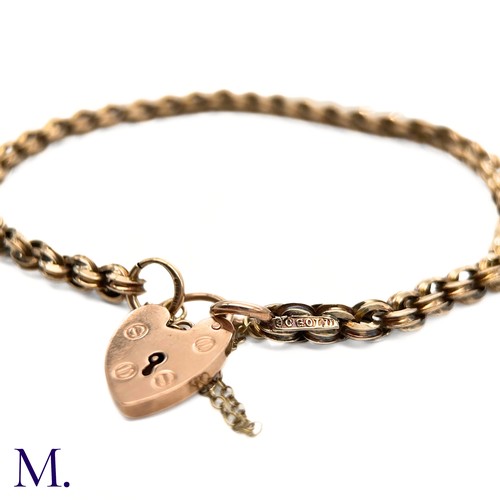 28 - An Antique 9ct Gold Fancy Link Bracelet.

The 9ct rose gold bracelet is secured with a heart-shaped ... 