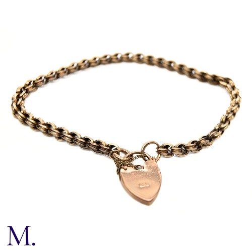 28 - An Antique 9ct Gold Fancy Link Bracelet.

The 9ct rose gold bracelet is secured with a heart-shaped ... 