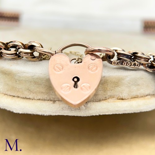 28 - An Antique 9ct Gold Fancy Link Bracelet.

The 9ct rose gold bracelet is secured with a heart-shaped ... 