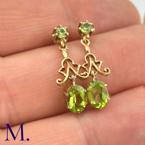 26 - A Pair of Antique Peridot Earrings

The peridot earrings are set in 9ct yellow gold. The earrings ar... 