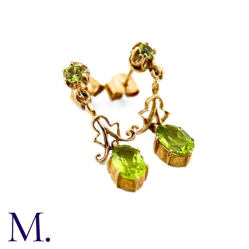 26 - A Pair of Antique Peridot Earrings

The peridot earrings are set in 9ct yellow gold. The earrings ar... 