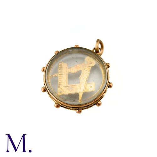 25 - An Antique Masonic Charm

The 9ct rose gold charm has masonic set squares inside a glass locket.

We... 