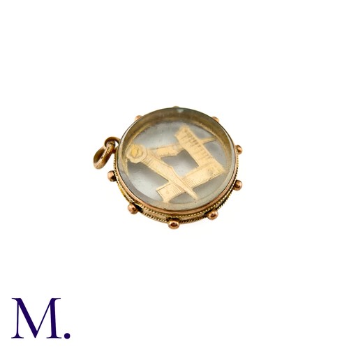 25 - An Antique Masonic Charm

The 9ct rose gold charm has masonic set squares inside a glass locket.

We... 