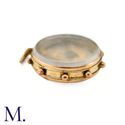 25 - An Antique Masonic Charm

The 9ct rose gold charm has masonic set squares inside a glass locket.

We... 