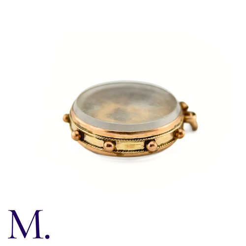 25 - An Antique Masonic Charm

The 9ct rose gold charm has masonic set squares inside a glass locket.

We... 