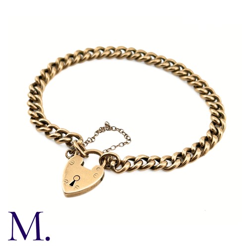 11 - An Antique Rose Gold Curb Bracelet

The 9ct rose gold bracelet is secured with a heart padlock and s... 