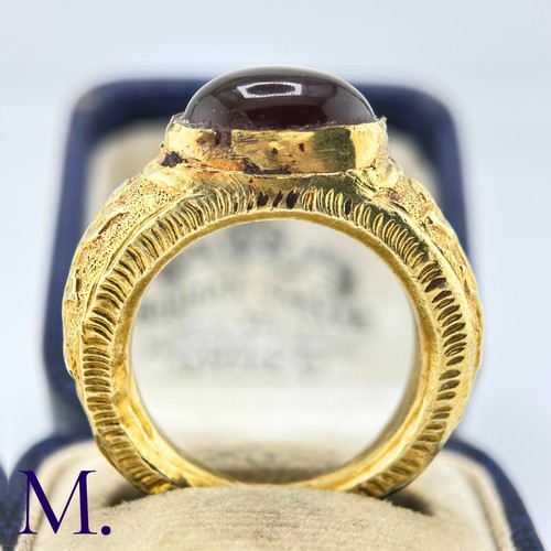 73 - An Antique Garnet Signet Ring

The exceptional ring is crafted from high carat gold with engravings ... 