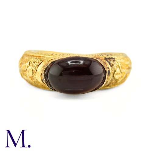 73 - An Antique Garnet Signet Ring

The exceptional ring is crafted from high carat gold with engravings ... 