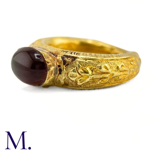 73 - An Antique Garnet Signet Ring

The exceptional ring is crafted from high carat gold with engravings ... 