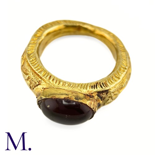 73 - An Antique Garnet Signet Ring

The exceptional ring is crafted from high carat gold with engravings ... 