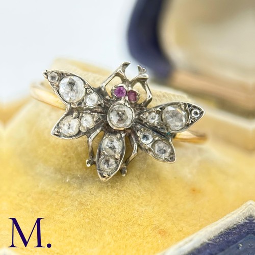 36 - An Antique Diamond Insect Ring

The yellow gold band is set with a winged insect set with old cut di... 