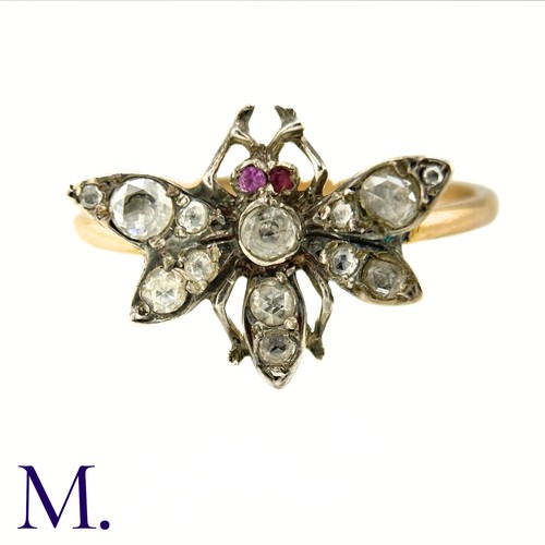 36 - An Antique Diamond Insect Ring

The yellow gold band is set with a winged insect set with old cut di... 