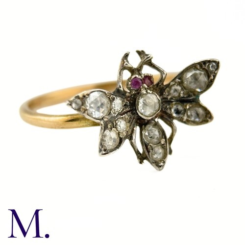 36 - An Antique Diamond Insect Ring

The yellow gold band is set with a winged insect set with old cut di... 