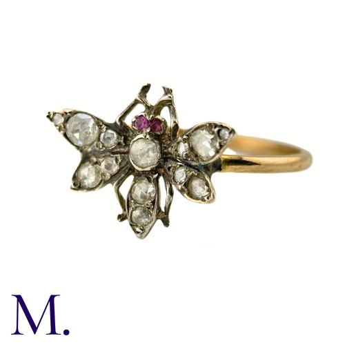 36 - An Antique Diamond Insect Ring

The yellow gold band is set with a winged insect set with old cut di... 