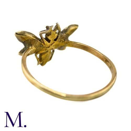 36 - An Antique Diamond Insect Ring

The yellow gold band is set with a winged insect set with old cut di... 