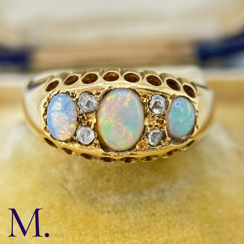 116 - An Antique Opal and Diamond Ring

The 18ct yellow gold ring is set with three good colour opals with... 