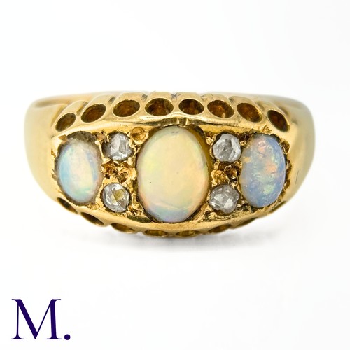 116 - An Antique Opal and Diamond Ring

The 18ct yellow gold ring is set with three good colour opals with... 