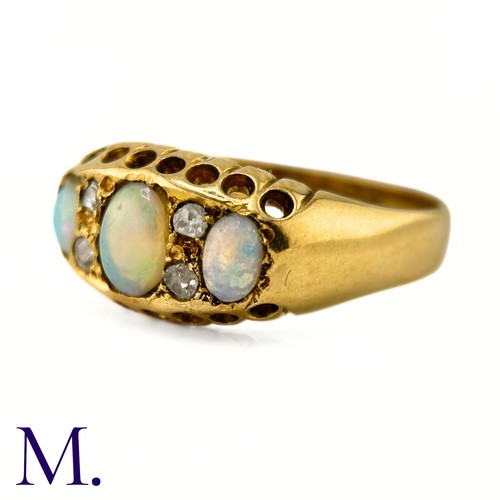 116 - An Antique Opal and Diamond Ring

The 18ct yellow gold ring is set with three good colour opals with... 