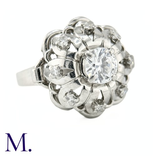 54 - A French Diamond Cluster Ring

The French ring is set with a round cut diamond to the centre of appr... 