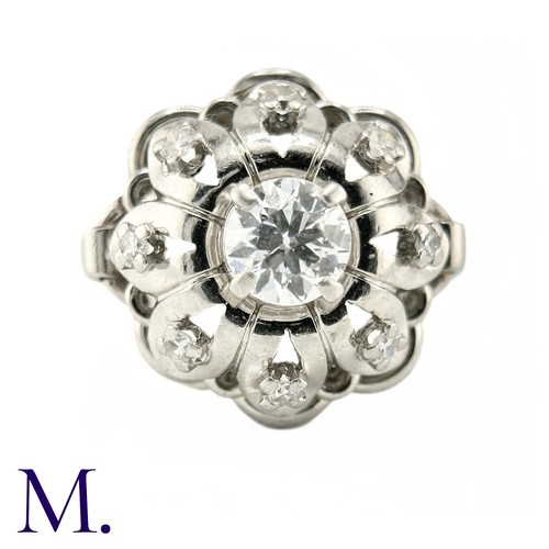 54 - A French Diamond Cluster Ring

The French ring is set with a round cut diamond to the centre of appr... 