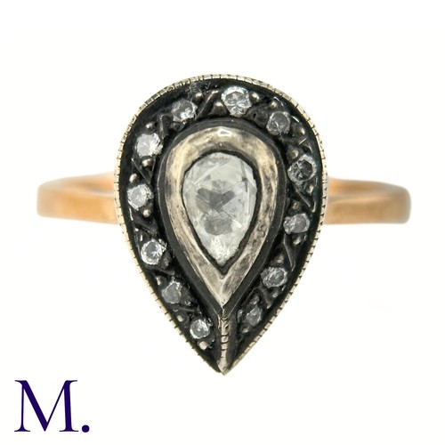 47 - An Antique Rose Diamond Ring

The rose gold band tapers into a pear-shaped setting in silver which i... 