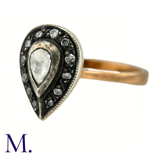 47 - An Antique Rose Diamond Ring

The rose gold band tapers into a pear-shaped setting in silver which i... 