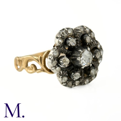 2 - An Antique Rose Diamond Cluster Ring

The ring is set with a 0.20ct old cut diamond to the centre wi... 