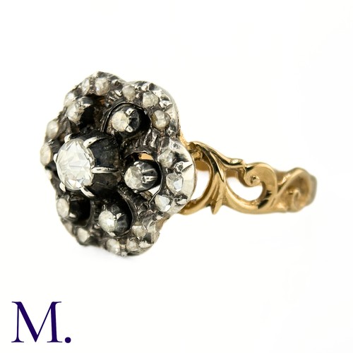 2 - An Antique Rose Diamond Cluster Ring

The ring is set with a 0.20ct old cut diamond to the centre wi... 