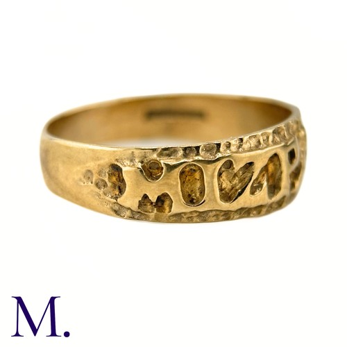 29 - A 9ct Gold Mizpah Ring

The 9ct yellow gold ring is embossed to the front with the word 'mizpah'.

W... 