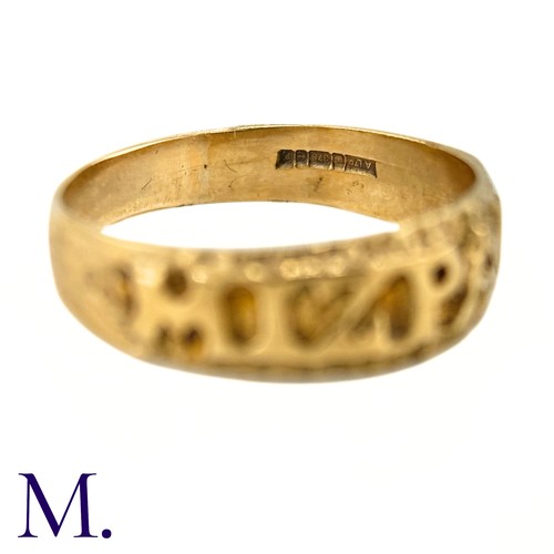 29 - A 9ct Gold Mizpah Ring

The 9ct yellow gold ring is embossed to the front with the word 'mizpah'.

W... 