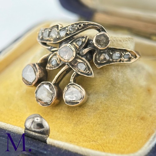 39 - An Antique Rose Diamond Spray Ring

The yellow gold band is set with a floral spray set with rose di... 