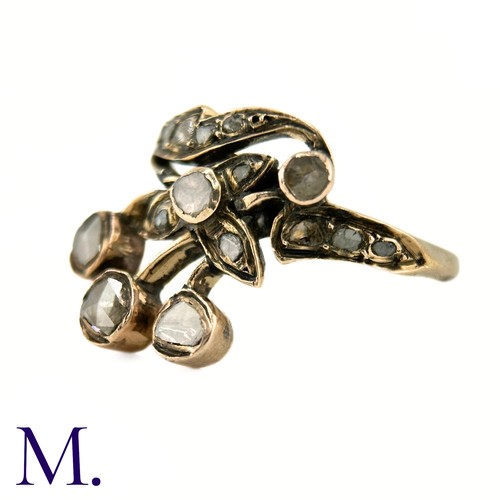 39 - An Antique Rose Diamond Spray Ring

The yellow gold band is set with a floral spray set with rose di... 