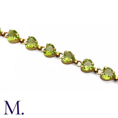 23 - Vintage Peridot and Gold Bracelet (10ct Gold)

The 10ct yellow gold bracelet is made up of twenty-on... 