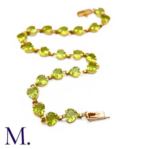 23 - Vintage Peridot and Gold Bracelet (10ct Gold)

The 10ct yellow gold bracelet is made up of twenty-on... 