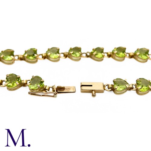 23 - Vintage Peridot and Gold Bracelet (10ct Gold)

The 10ct yellow gold bracelet is made up of twenty-on... 