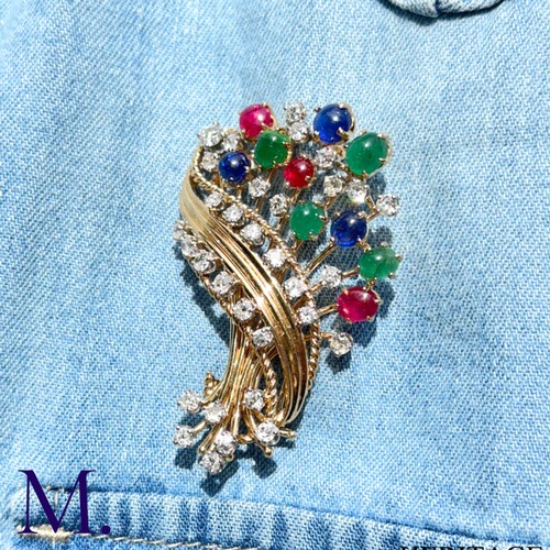 84 - Retro Tutti Frutti Diamond and Gemstone Brooch

This 1950s Tutti Frutti brooch is set with  ruby, em... 