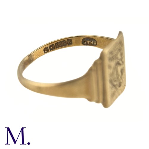 74 - An Art Deco Engraved Signet Ring

The 9ct yellow gold ring has a rectangular face with engraved mono... 