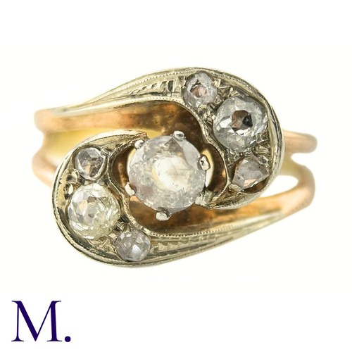 75 - A Diamond Twist Ring

The yellow gold ring is set with a 0.35ct old cut diamond to the centre with t... 