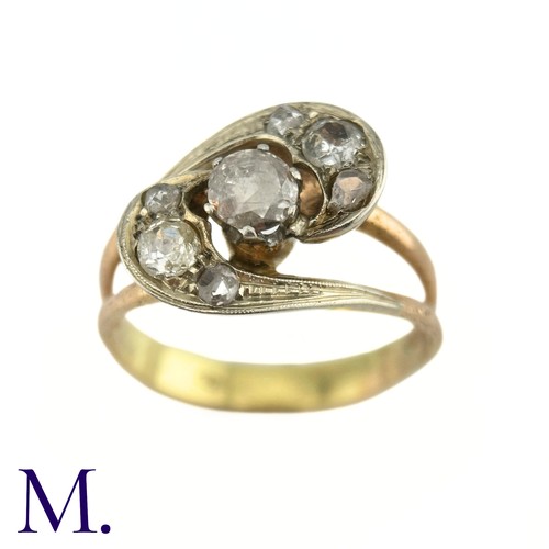 75 - A Diamond Twist Ring

The yellow gold ring is set with a 0.35ct old cut diamond to the centre with t... 