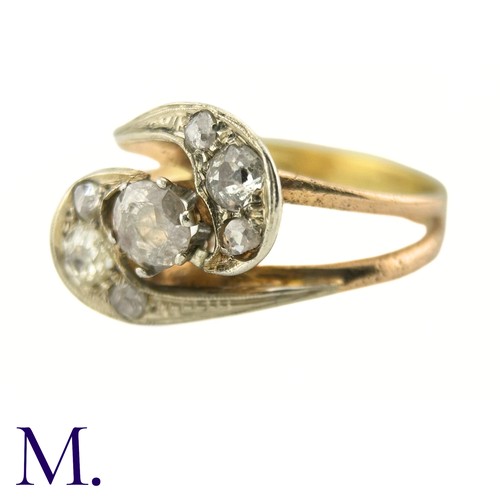 75 - A Diamond Twist Ring

The yellow gold ring is set with a 0.35ct old cut diamond to the centre with t... 