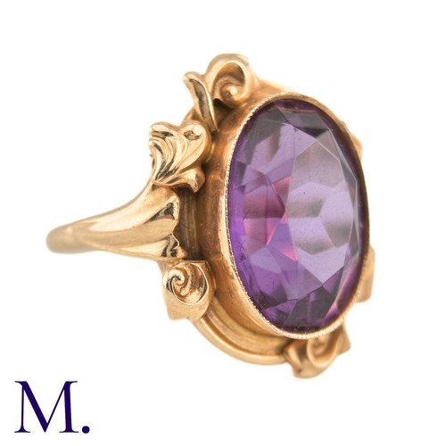 15 - A Russian Purple Sapphire Ring

The 14ct rose gold ring, with Russian hallmarks, is set with a large... 