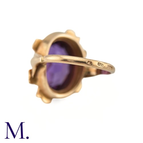 15 - A Russian Purple Sapphire Ring

The 14ct rose gold ring, with Russian hallmarks, is set with a large... 