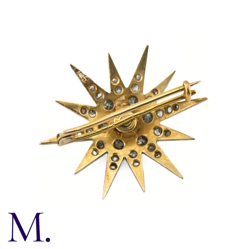 53 - A Victorian Diamond Star Brooch

The 19th Century star brooch is set with old cut diamonds, the cent... 