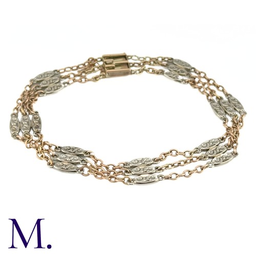 64 - A Two-Colour Gold Bracelet

The two-colour gold bracelet tests as 9ct gold.  It is secured with a fl... 