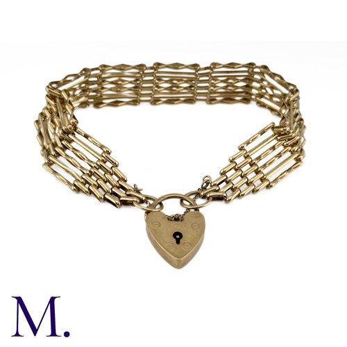 17 - A Vintage Gold Gate Bracelet

The 9ct yellow gold gate bracelet is secured with a heart-shaped padlo... 