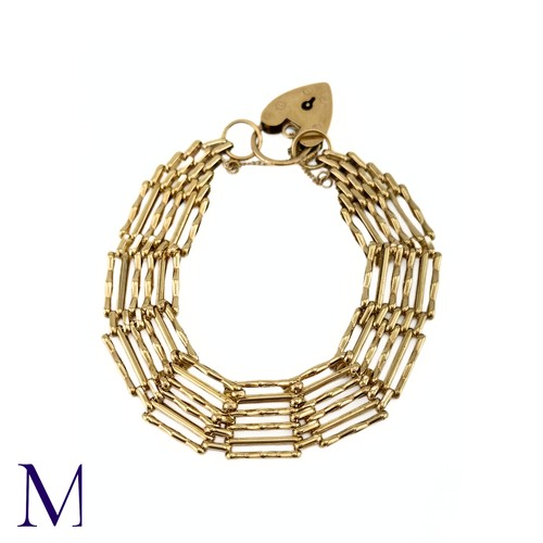 17 - A Vintage Gold Gate Bracelet

The 9ct yellow gold gate bracelet is secured with a heart-shaped padlo... 